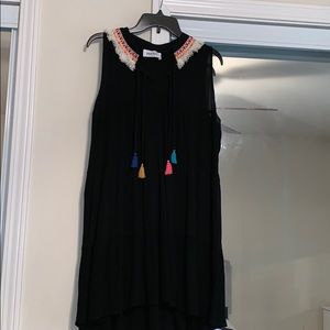 Black flowy tiered dress with colorful tassels